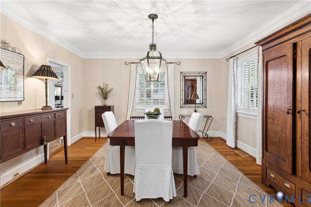 Oak floors, crown molding and closet for table linens.