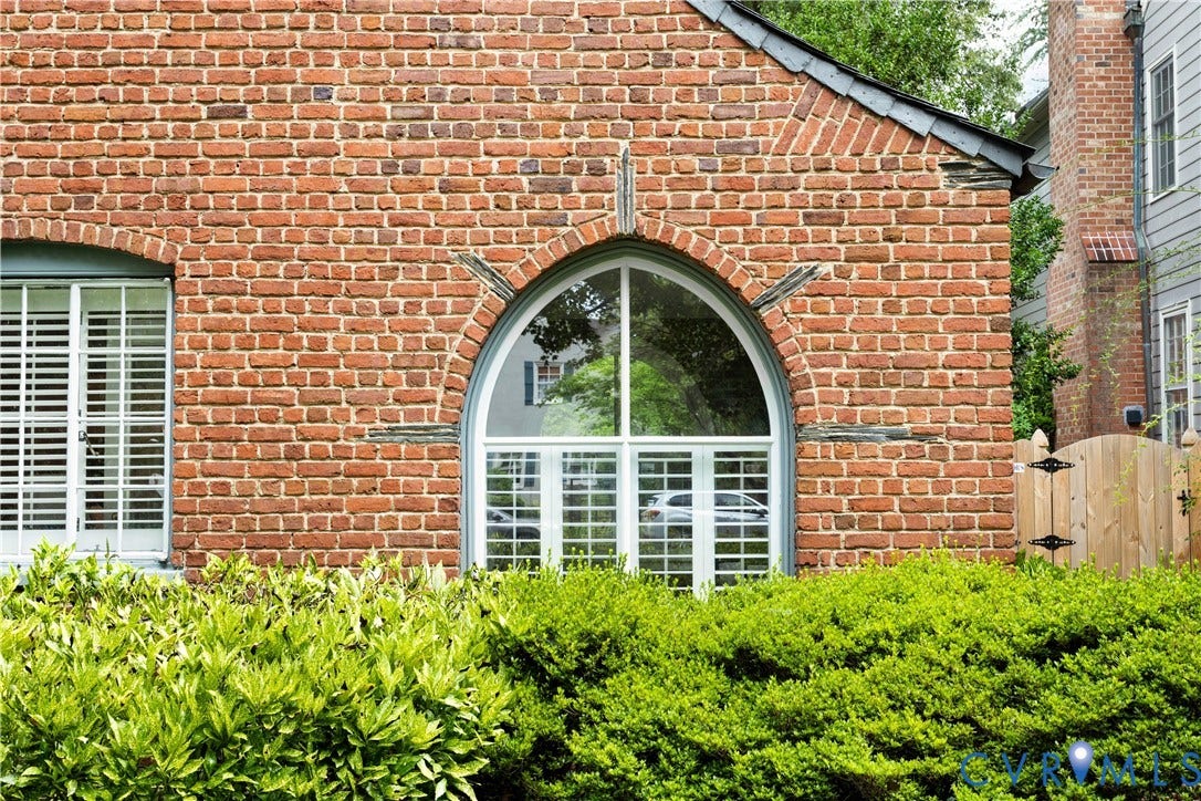 Arched windows and doors everywhere. Note the slate accents over the window