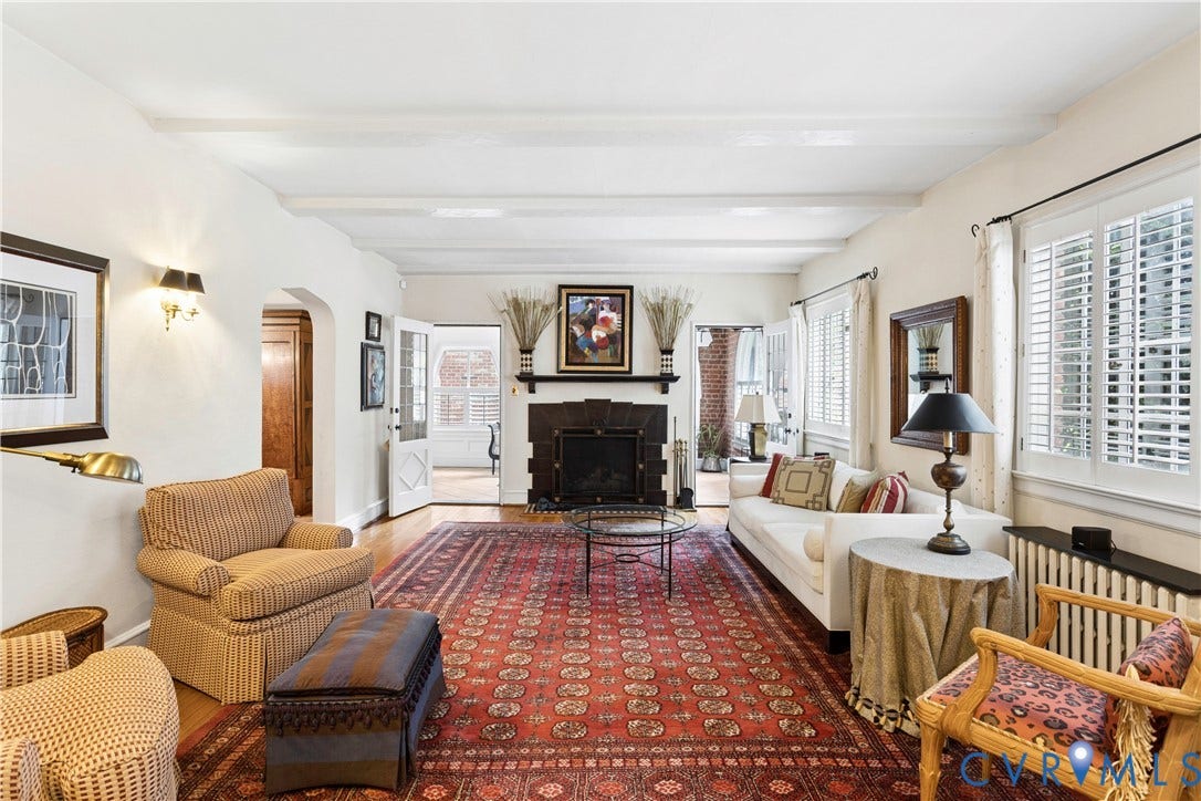 Oak floors, 3 member crown,shutters, beamed ceiling.