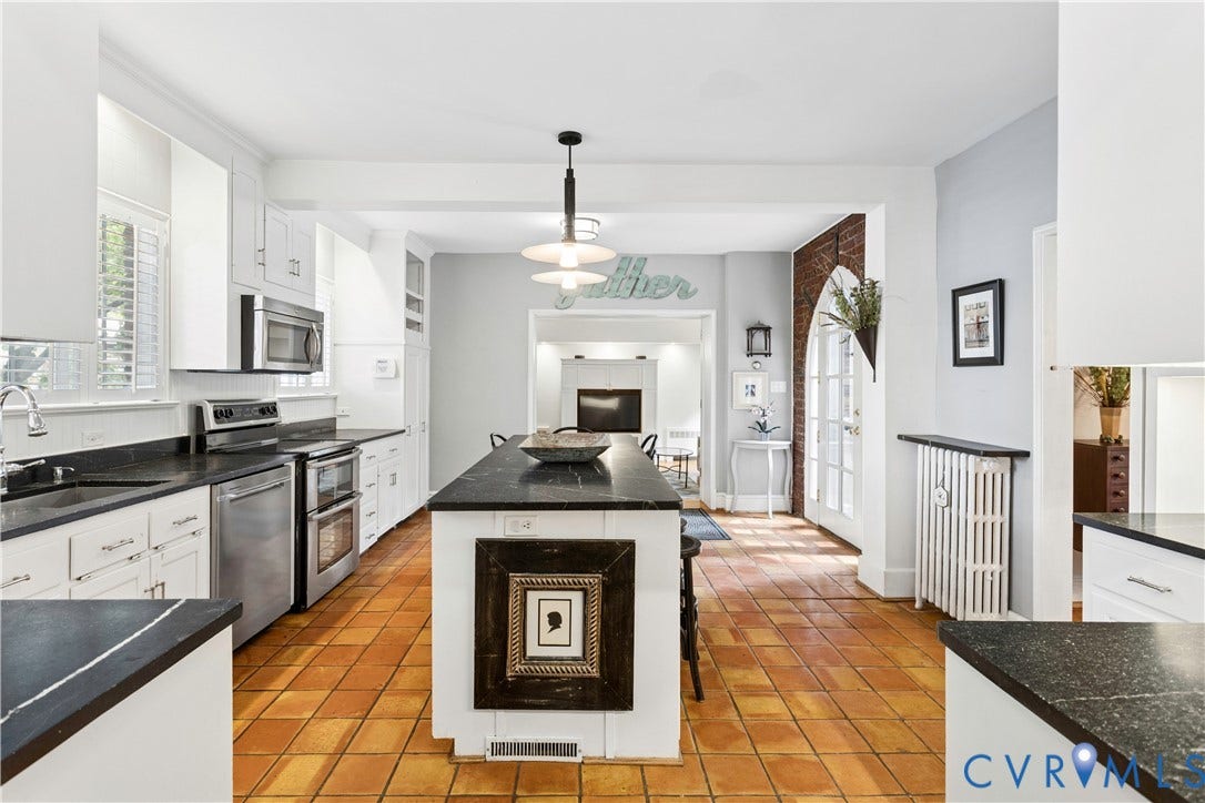 Space, space and more space.  Terra Cotta floors, soapstone countertops and plenty of cabinets.