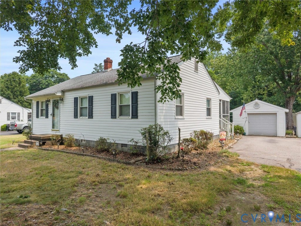 9633 Shamrock Drive, Centralia Gardens/Salem Woods, Chesterfield, VA 23237 White-sided residence featuring a red brick chimney and dark window shutters