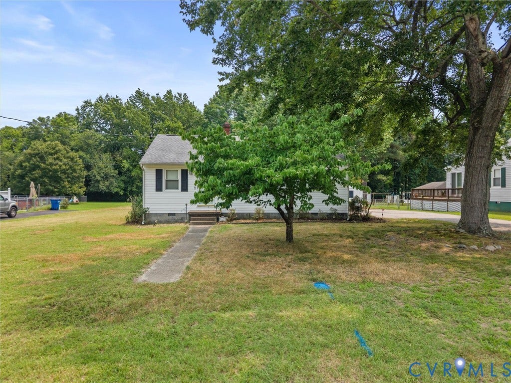 9633 Shamrock Drive, Centralia Gardens/Salem Woods, Chesterfield, VA 23237 White facade home with black window shutters and a concrete walkway