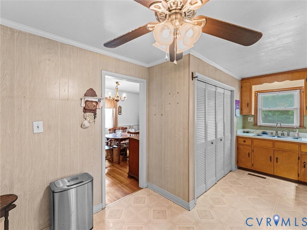 9633 Shamrock Drive, Centralia Gardens/Salem Woods, Chesterfield, VA 23237 Kitchen area with patterned vinyl flooring and wood-paneled walls