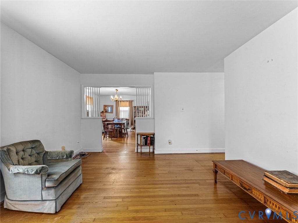 9633 Shamrock Drive, Centralia Gardens/Salem Woods, Chesterfield, VA 23237 Hardwood-style flooring throughout the main living area, with a partial wall featuring decorative vertical slats separating rooms
