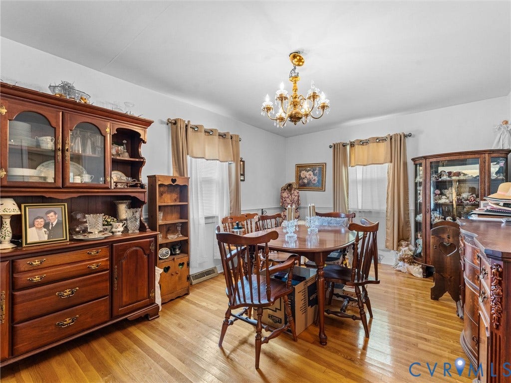 9633 Shamrock Drive, Centralia Gardens/Salem Woods, Chesterfield, VA 23237 Dining area featuring wood-finish flooring and a central chandelier
