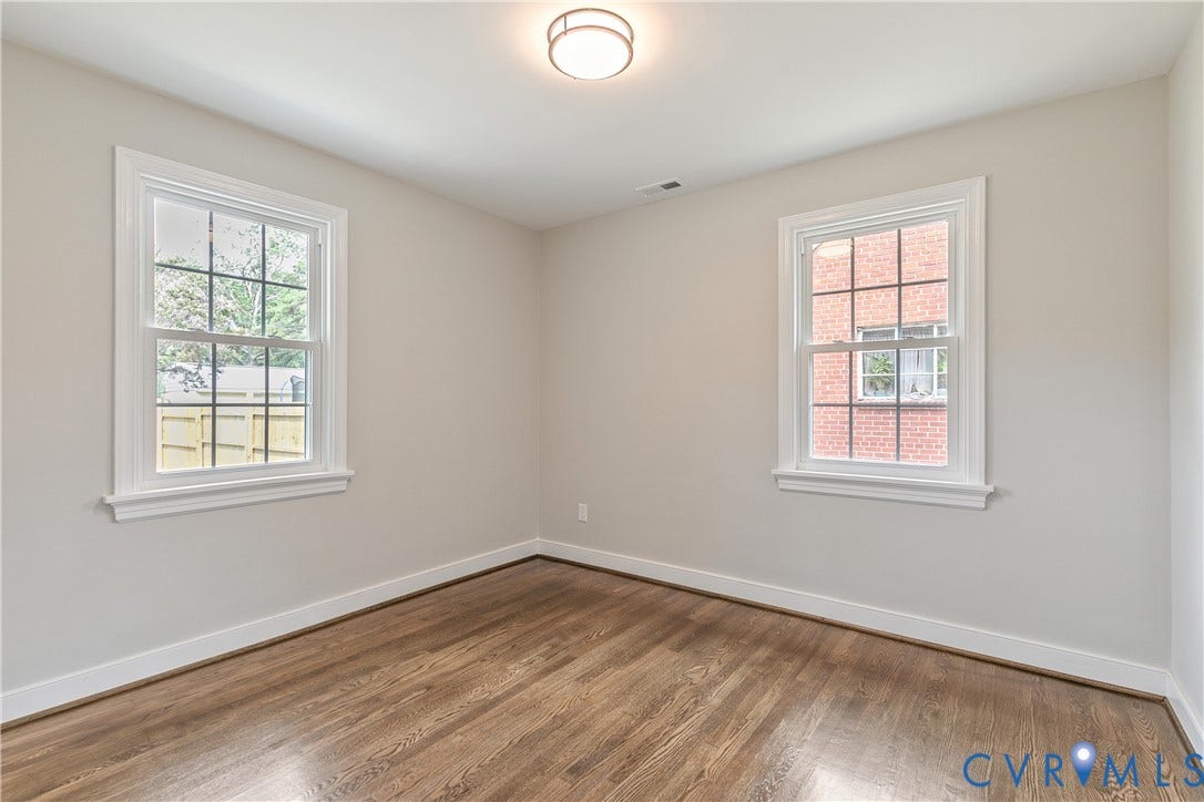 3512 Fendall Avenue, Edgewood, Richmond, VA 23222 Bright interior space featuring wood-finish flooring, white baseboards, and neutral wall paint