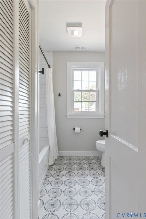 3512 Fendall Avenue, Edgewood, Richmond, VA 23222 Bathroom featuring a patterned tile floor, a shower/tub combination with subway tile surround, a window with grid panes, and a white toilet