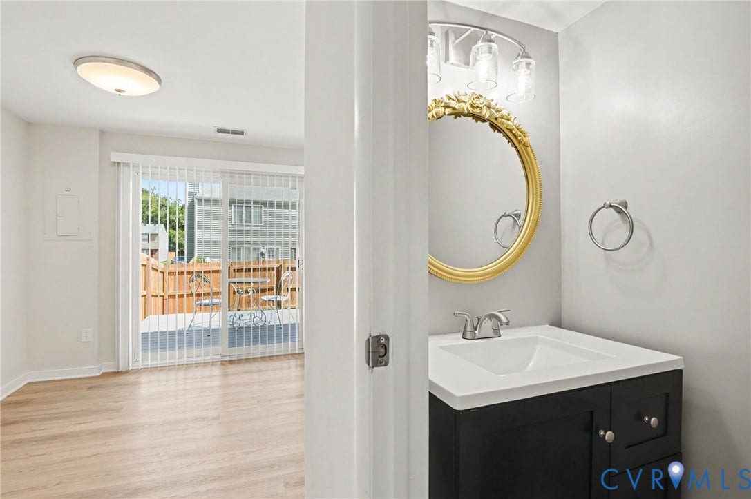 Half bath and view of eat -in area of Kitchen