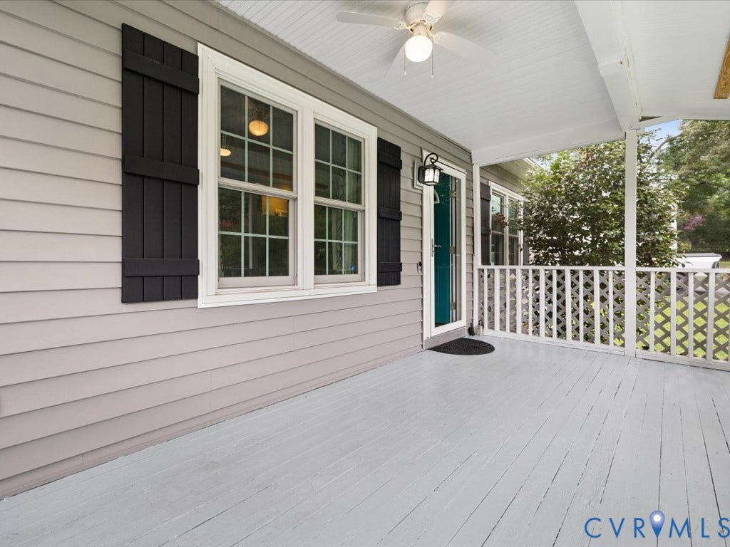 12230 Harrowgate Road, Chesterfield, VA 23831 Covered front porch featuring light gray wood-finish decking, white lattice railing, and a beadboard ceiling with a ceiling fan