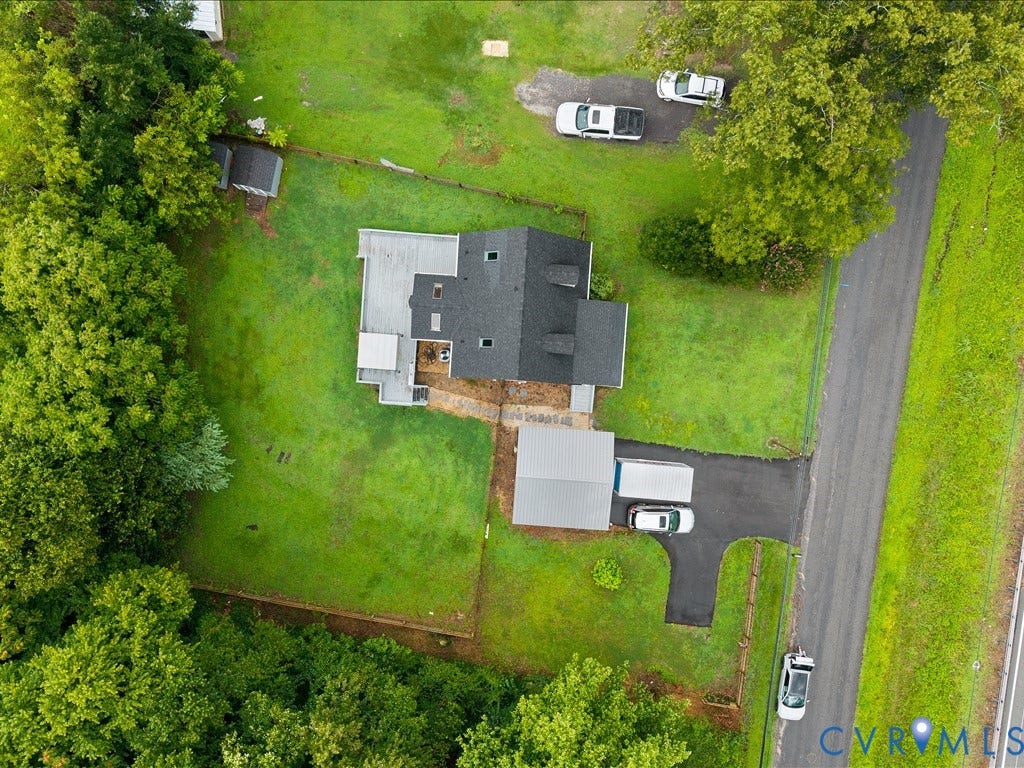 12230 Harrowgate Road, Chesterfield, VA 23831 Aerial perspective showcasing a property with extensive green space, a gabled roofline, and mature perimeter trees