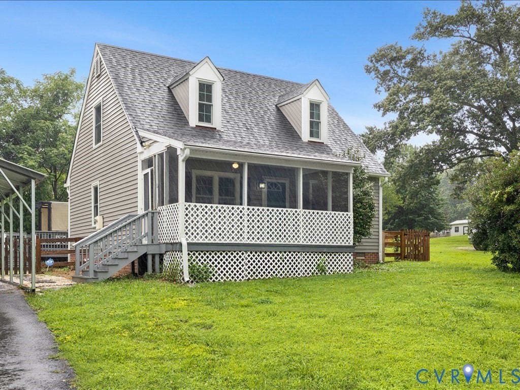 12230 Harrowgate Road, Chesterfield, VA 23831 Gabled roofline with dormer windows, grey siding exterior, screened front porch with white lattice railing, exterior stairs with handrails, and an expansive lawn