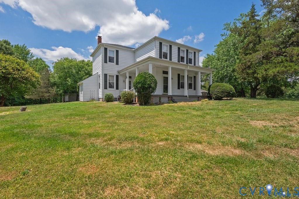 11300 Aspen Grove Drive, Glen Allen, VA 23059 Traditional two-story residence featuring white siding, black shutters, and a covered front porch with white columns