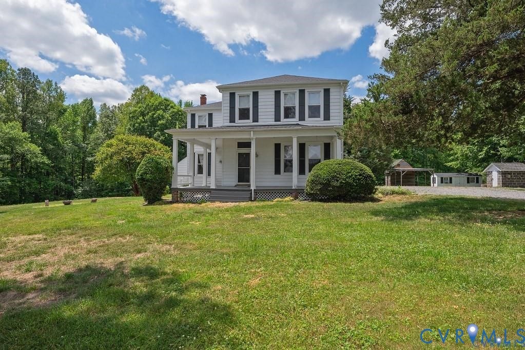 11300 Aspen Grove Drive, Glen Allen, VA 23059 Two-story white exterior with dark shutters, covered front porch, expansive front lawn, paved driveway, and detached outbuilding