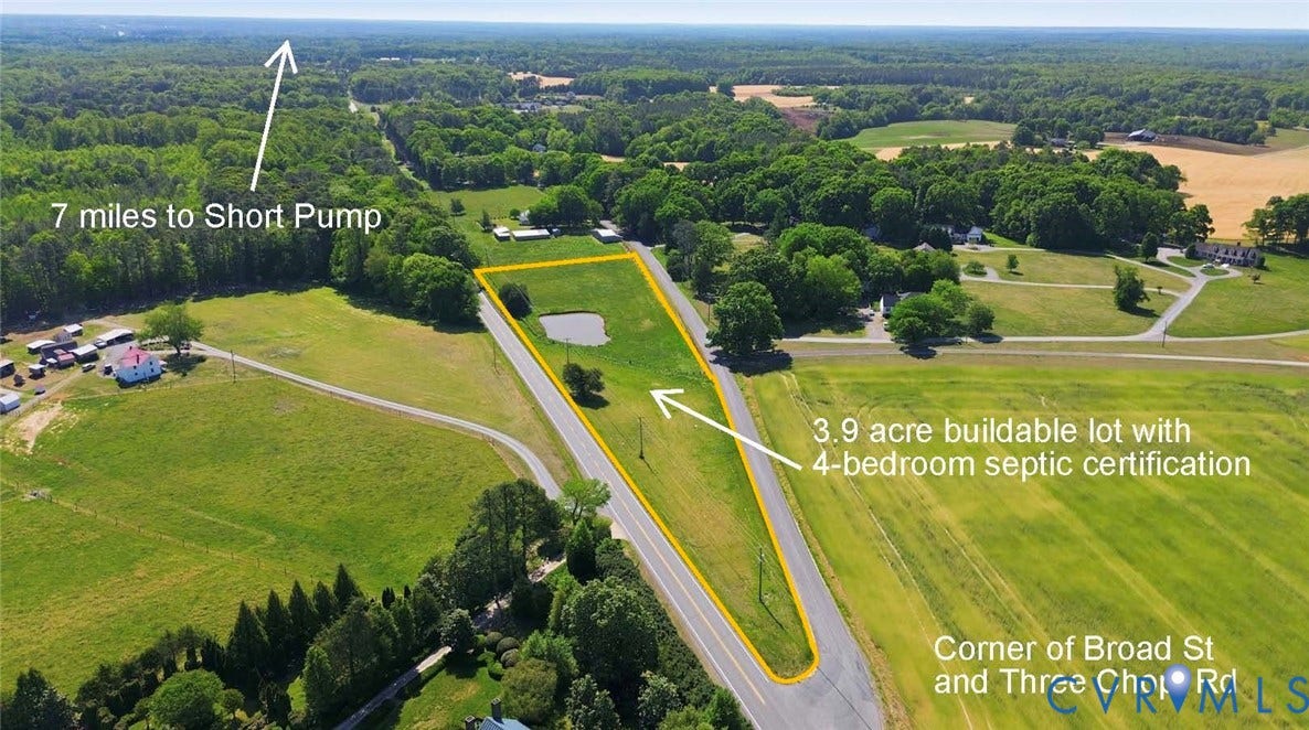 3.9-acre buildable lot featuring a natural pond and established trees