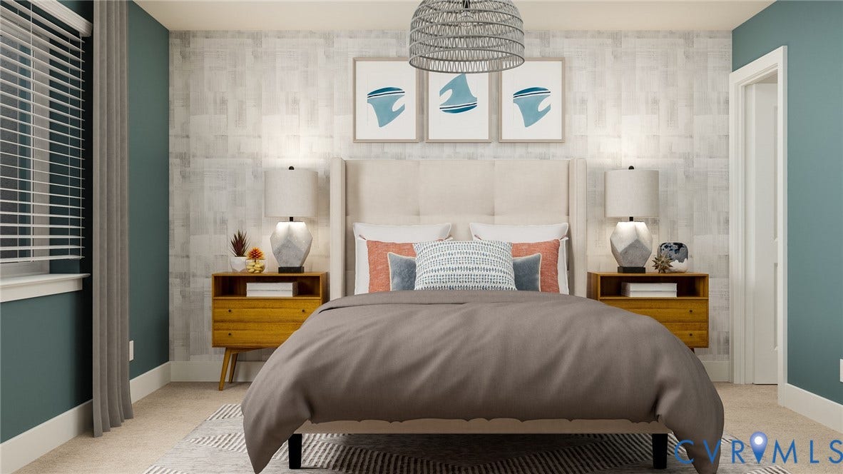 Bedroom featuring a textured accent wall, soft neutral carpeting, and a window with blinds