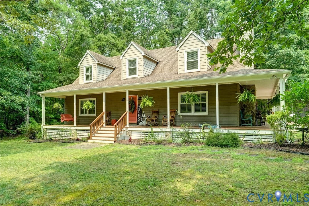 1174 Dorset Road, Powhatan, VA 23139 Craftsman-style home featuring a full-width covered front porch, dormer windows, and a prominent stone column