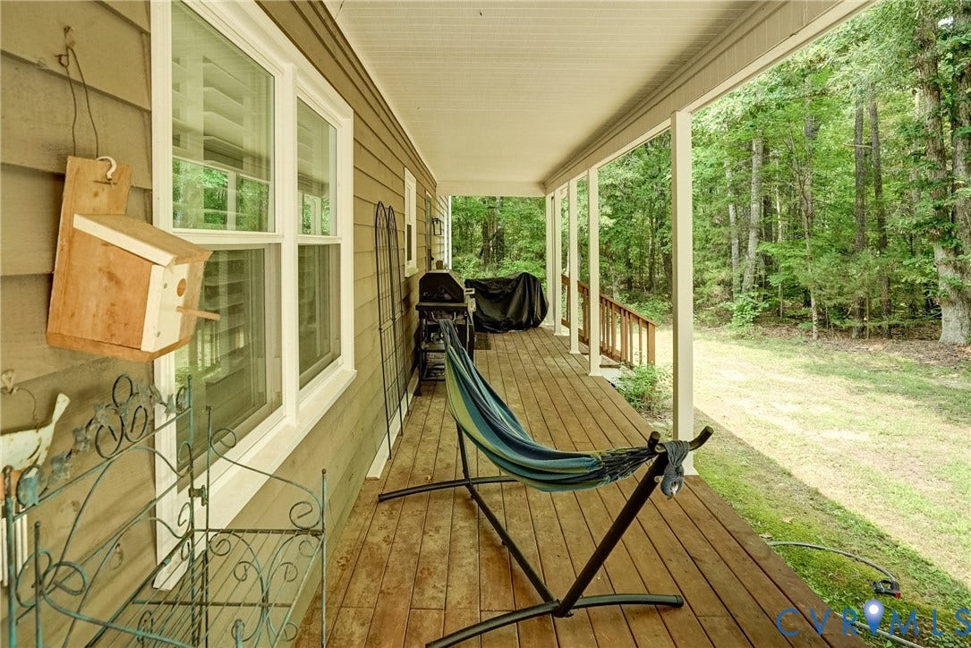 1174 Dorset Road, Powhatan, VA 23139 Covered porch featuring wood-finish flooring, white trim, and a horizontal siding exterior