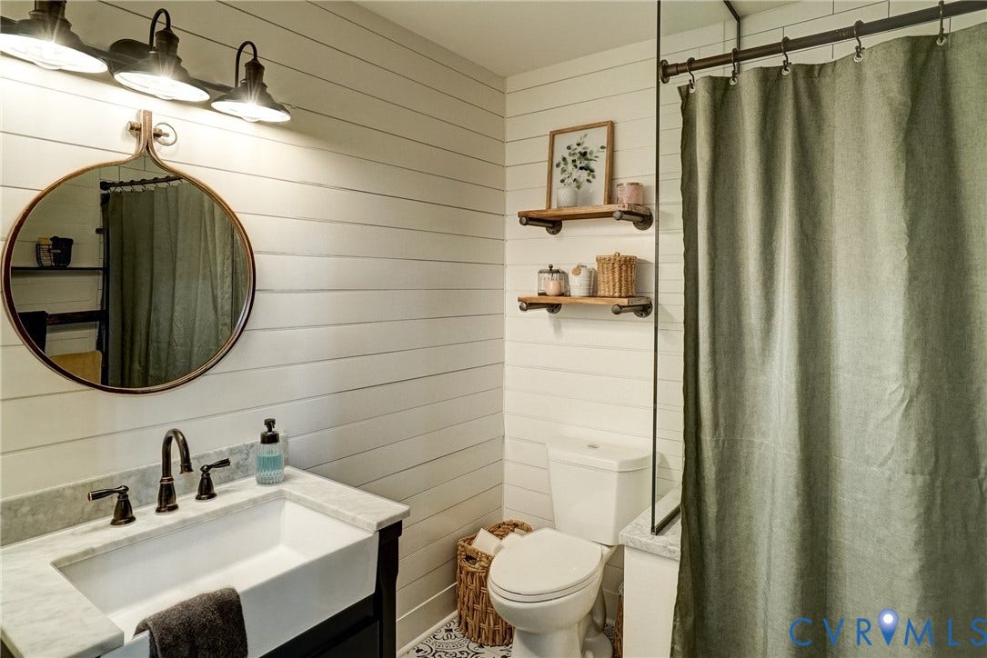 1174 Dorset Road, Powhatan, VA 23139 Bathroom featuring white shiplap walls and patterned floor tile