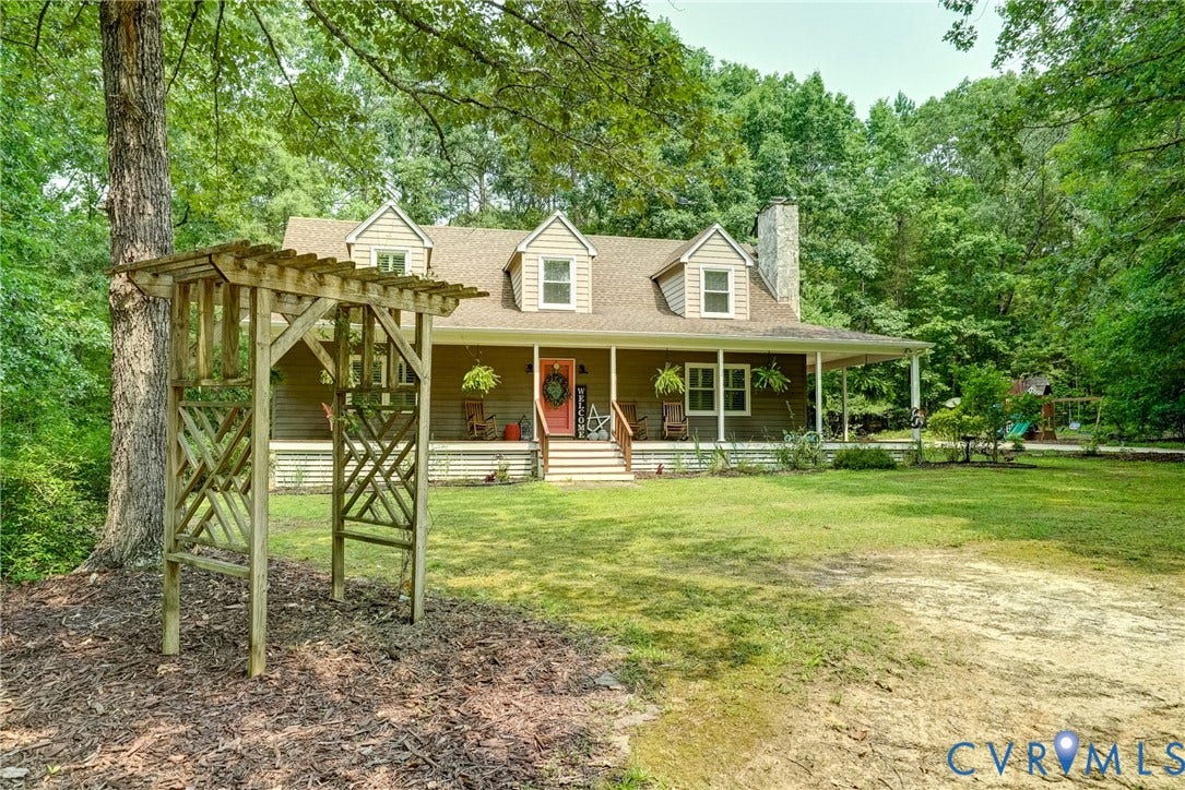 1174 Dorset Road, Powhatan, VA 23139 Traditional style home featuring a covered front porch, dormer windows, and a prominent chimney