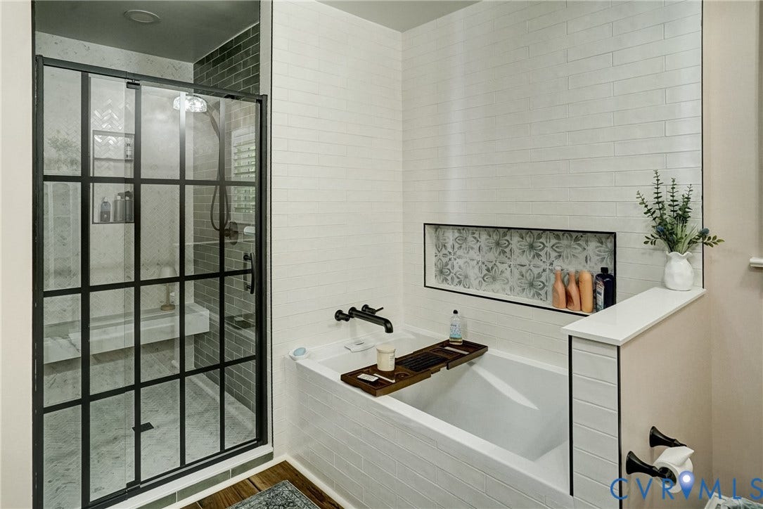 1174 Dorset Road, Powhatan, VA 23139 Modern bathroom featuring a soaking tub, subway tile surround, and a recessed niche with decorative tile