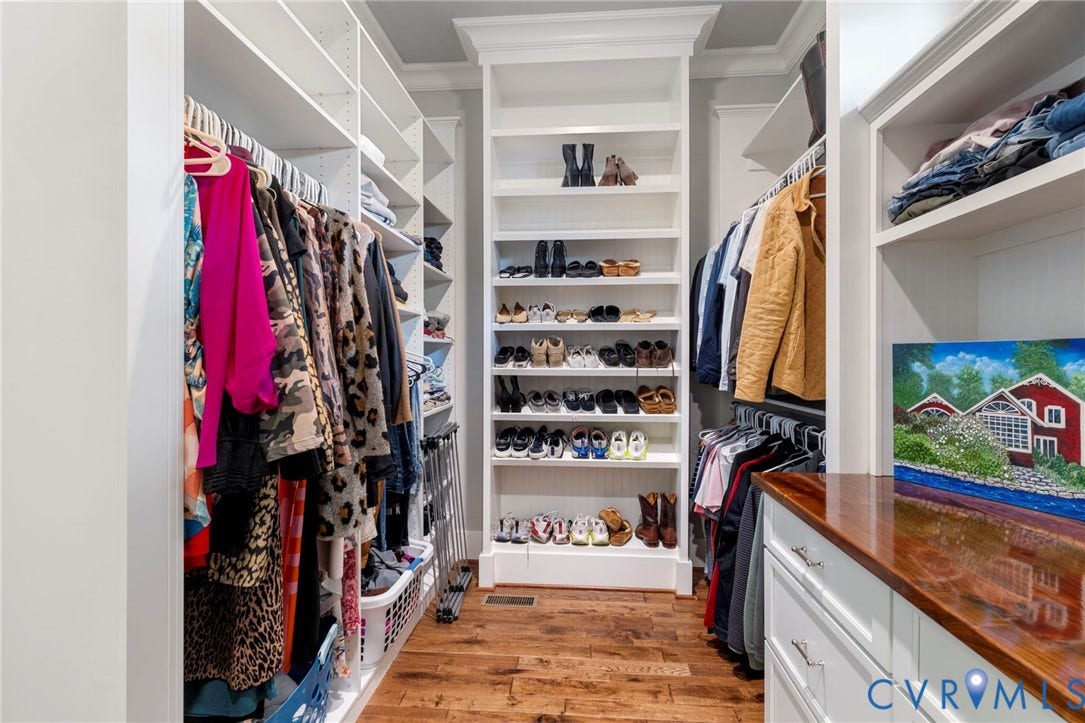 1925 Muswell Court, Hallsley, Midlothian, VA 23112 Custom closet system featuring extensive shelving, hanging rods, and built-in drawers