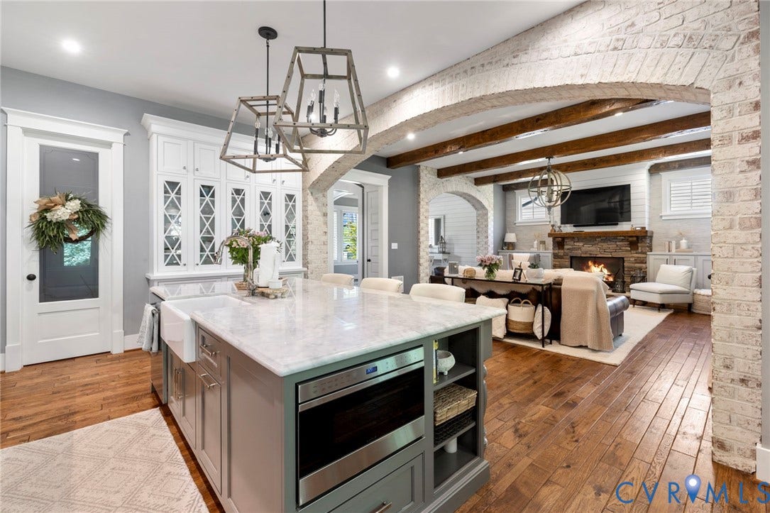 1925 Muswell Court, Hallsley, Midlothian, VA 23112 Kitchen island featuring a farmhouse sink, integrated microwave, and marble-finish countertop
