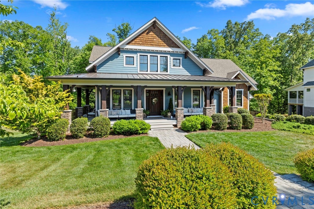 1925 Muswell Court, Hallsley, Midlothian, VA 23112 Craftsman-style exterior with blue siding, wood shake accents, and a covered front porch featuring stone-clad columns