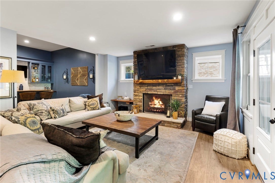 1925 Muswell Court, Hallsley, Midlothian, VA 23112 Spacious living area featuring a stacked stone fireplace with a substantial wood mantle