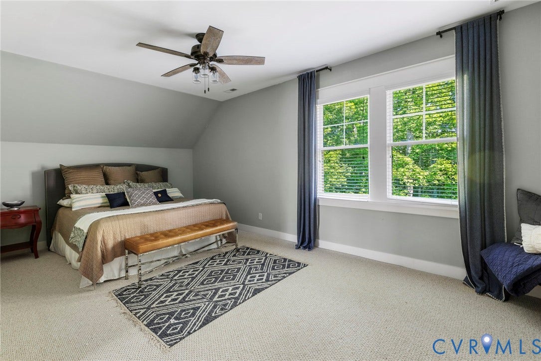 1925 Muswell Court, Hallsley, Midlothian, VA 23112 Carpeted room featuring a ceiling fan with integrated lighting, two windows with white blinds, and light gray walls
