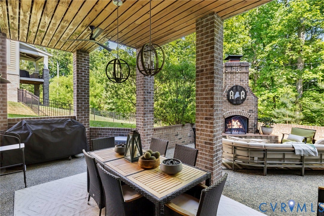 1925 Muswell Court, Hallsley, Midlothian, VA 23112 Covered patio featuring a wood-finish ceiling, brick support pillars, and an outdoor fireplace