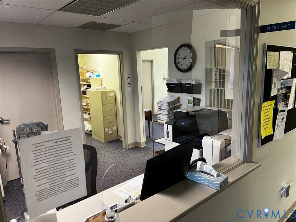 4064 James Madison Highway, Fork Union, VA 23055 Windowed service counter with a clear protective barrier and an integrated check-out sign