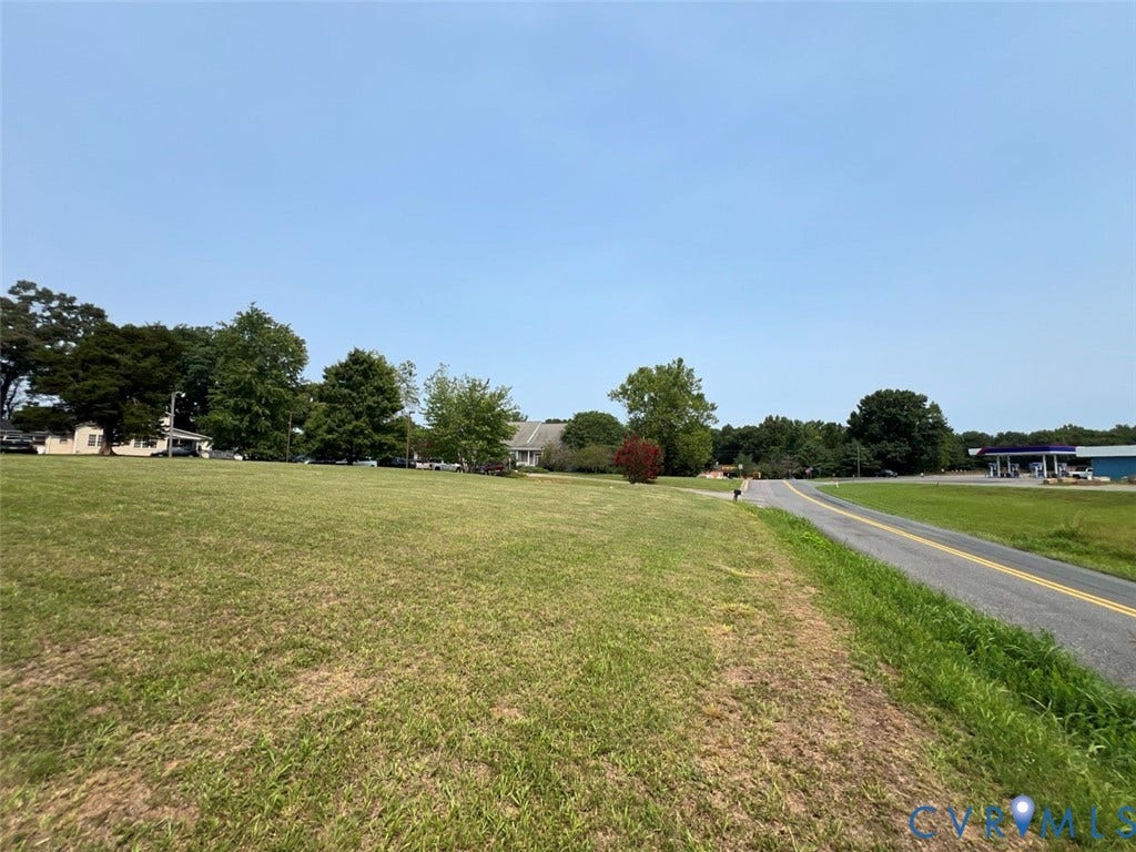 4064 James Madison Highway, Fork Union, VA 23055 Expansive grassy lot bordered by a paved road