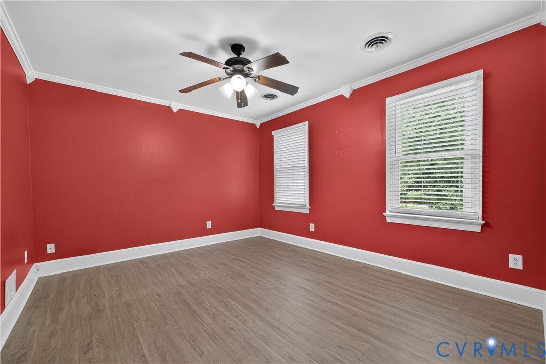 8436 Sir Lionel Place, Kingsland Wood, Ampthill, VA 23237 Wood-finish flooring with white trim, two windows with blinds, a ceiling fan, and crown molding