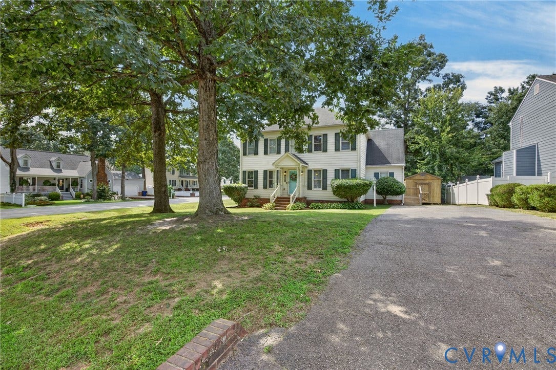 8436 Sir Lionel Place, Kingsland Wood, Ampthill, VA 23237 Two-story home with light-colored siding and dark shutters