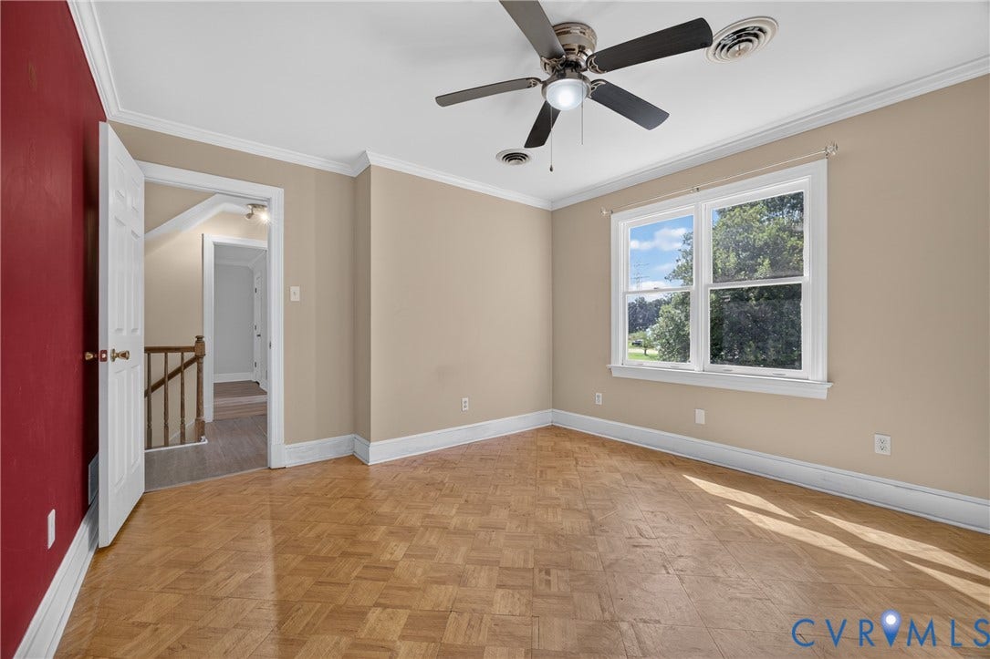 8436 Sir Lionel Place, Kingsland Wood, Ampthill, VA 23237 Room featuring wood parquet flooring, crown molding, a ceiling fan with integrated lighting, and a large window with white trim