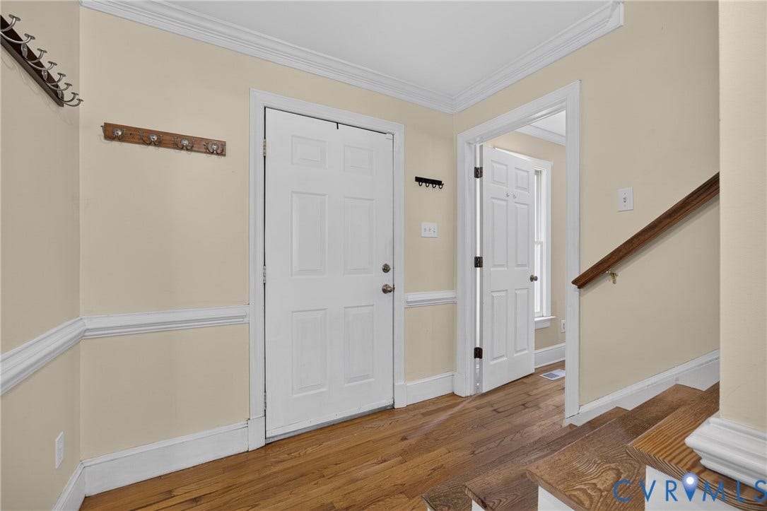 8436 Sir Lionel Place, Kingsland Wood, Ampthill, VA 23237 Wood-finish flooring, white paneled doors, and crown molding