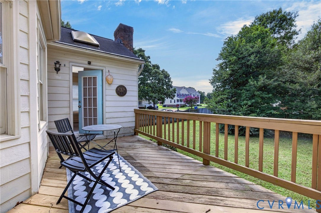 8436 Sir Lionel Place, Kingsland Wood, Ampthill, VA 23237 Exterior wood siding with a skylight and an attached wood deck