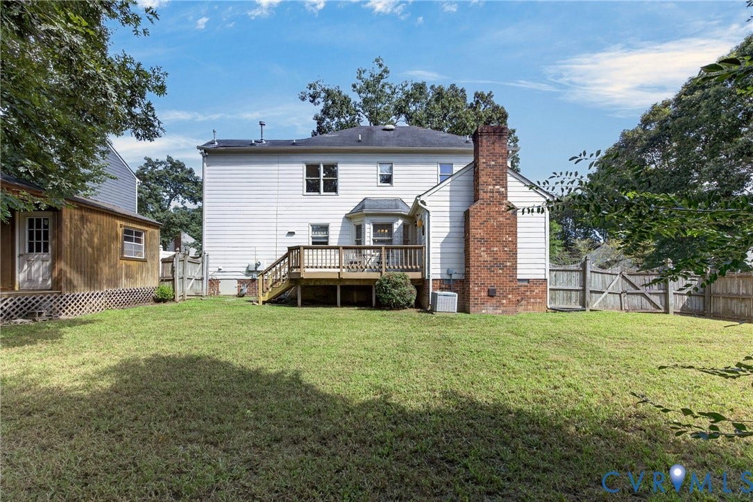 8436 Sir Lionel Place, Kingsland Wood, Ampthill, VA 23237 Charming two-story residence featuring white vinyl siding, a brick chimney, and a covered front porch with wooden railings