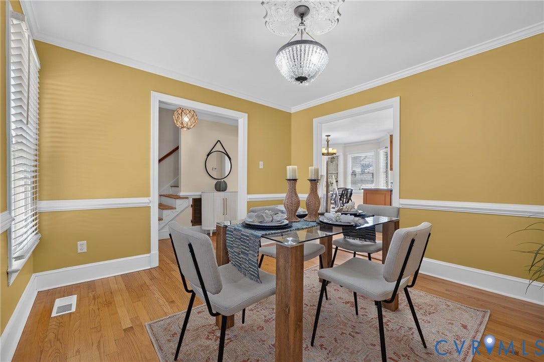 8436 Sir Lionel Place, Kingsland Wood, Ampthill, VA 23237 Hardwood flooring, crown molding, chair rail molding, and a crystal-beaded chandelier