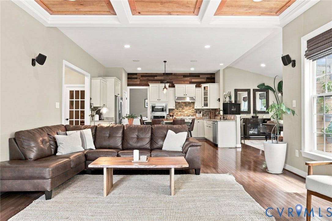 3655 Stone Harbor Drive, Midlothian, VA 23113 Open-concept living area featuring a coffered ceiling with wood-finish panels, recessed lighting, and rich wood-finish flooring