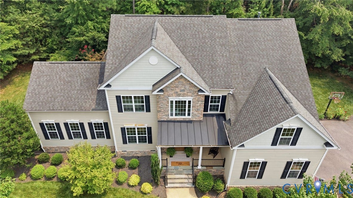 3655 Stone Harbor Drive, Midlothian, VA 23113 Two-story residence featuring light-colored siding and stone accents