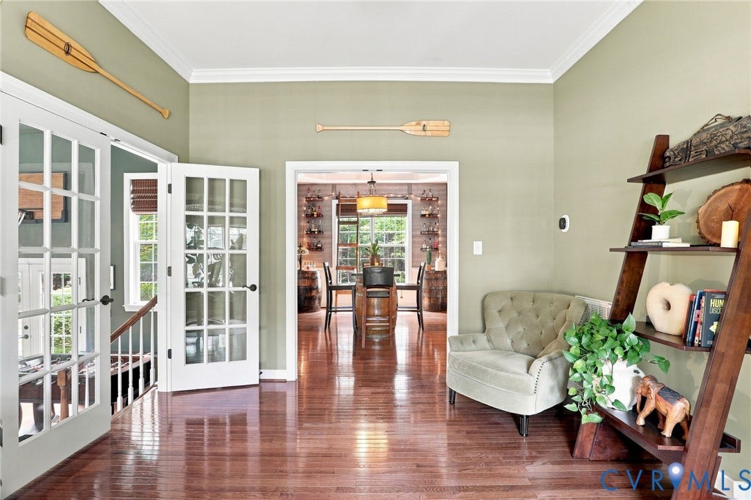 3655 Stone Harbor Drive, Midlothian, VA 23113 Hardwood flooring with a polished finish, crown molding, and a warm color palette