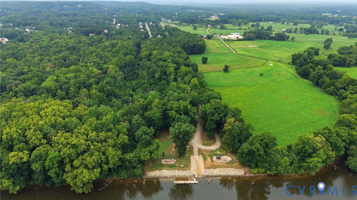 3655 Stone Harbor Drive, Midlothian, VA 23113 Waterfront property featuring a private boat launch, pier, and extensive wooded areas