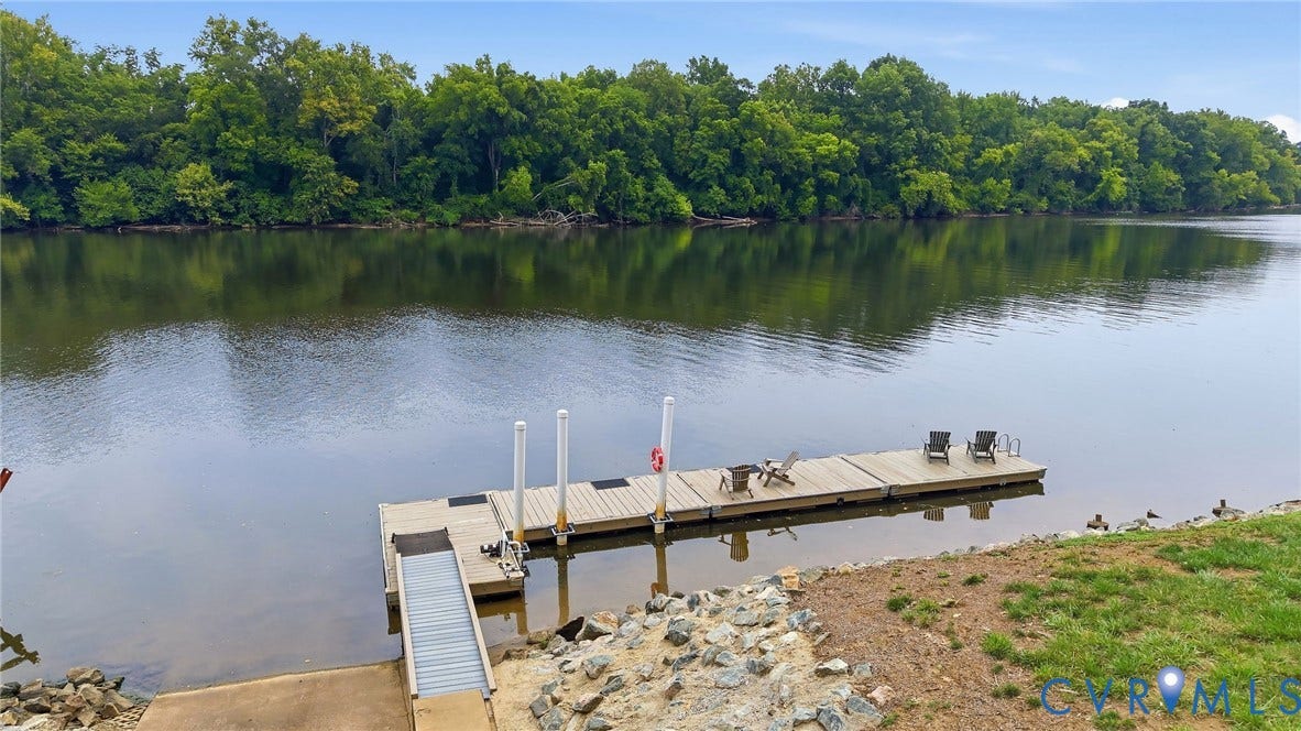 3655 Stone Harbor Drive, Midlothian, VA 23113 Private waterfront dock with a boat lift, direct water access, and a concrete boat ramp