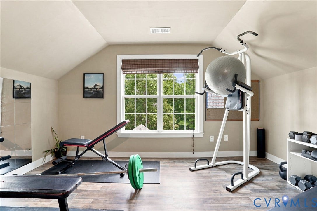 3655 Stone Harbor Drive, Midlothian, VA 23113 Versatile bonus room with sloped ceilings, wood-finish flooring, and a large window