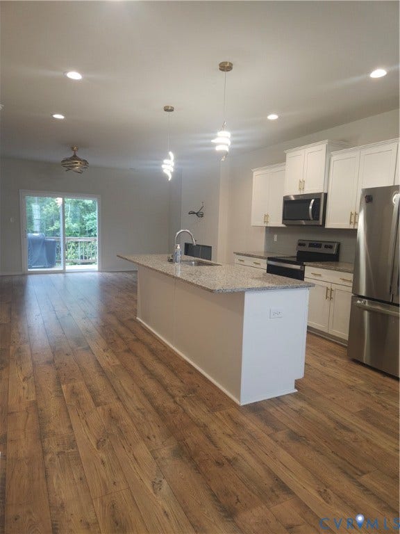 11304 Magill Terrace Drive, Chester, VA 23831 Kitchen island with a light-colored granite countertop and dual pendant lighting