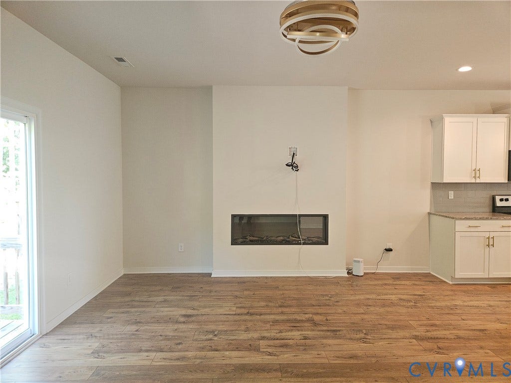 11304 Magill Terrace Drive, Chester, VA 23831 Wood-finish flooring throughout the space