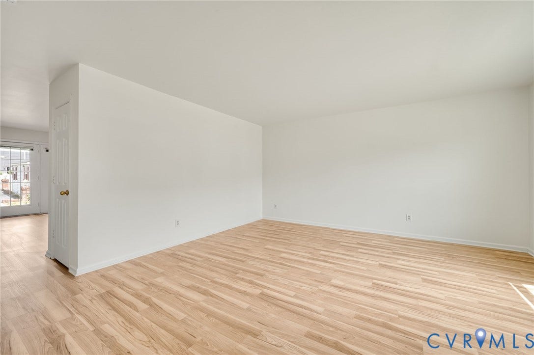 1723 Porter Street, Richmond, VA 23224 Spacious interior featuring light wood-finish flooring, white walls, and white baseboards