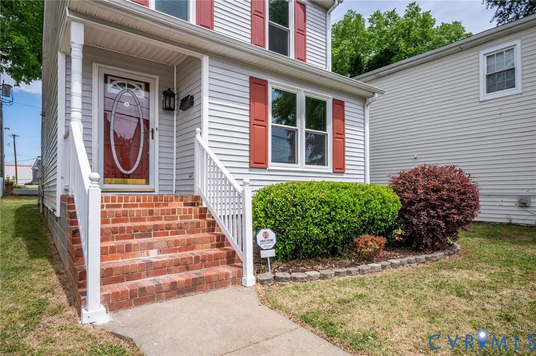 1723 Porter Street, Richmond, VA 23224 Siding exterior with red window shutters and a matching front door with oval glass insert