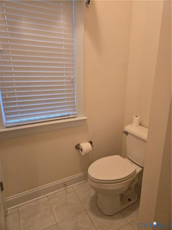 4401 Village Garden Circle, Chester, VA 23831 Ceramic tile flooring features a white toilet with a window above